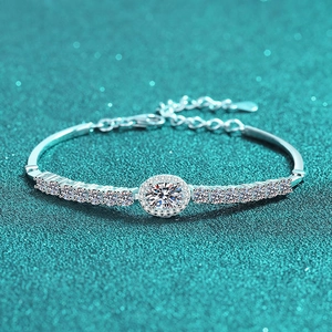 Elegant S925 silver bracelet with blue oval moissanite and pave diamonds on textured base