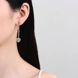 S925 silver long tassel earrings with sparkling heart-shaped moissanite drops on model