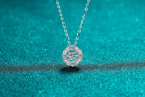 Macro detail of S925 sterling silver four-claw moissanite necklace pendant and fine chain