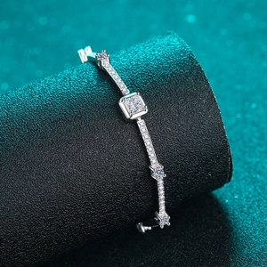 Elegant S925 sterling silver bracelet with a square-cut moissanite stone on a black stand