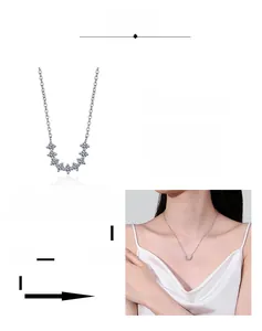 Detail of Moissanite smile pendant necklace with layered plating for platinum texture