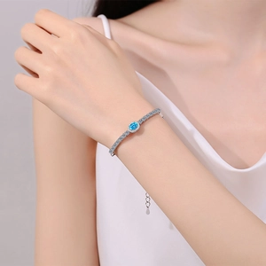 S925 sterling silver bracelet with oval sky blue moissanite and pavé set small gems
