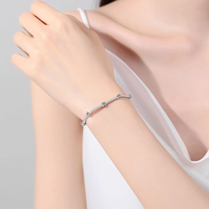 Elegant S925 sterling silver moissanite bracelet on a woman wrist with minimalist design