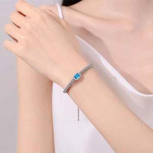 S925 Sterling Silver bracelet with blue emerald-cut stone and micro-pavé cubic zirconia