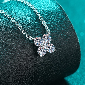 Sparkling S925 sterling silver moissanite necklace featuring a delicate flower petal pendant