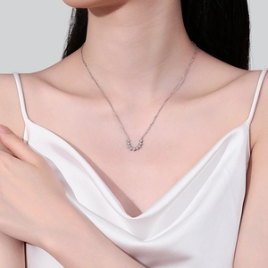 Elegant S925 sterling silver U-shaped moissanite necklace displayed on a model