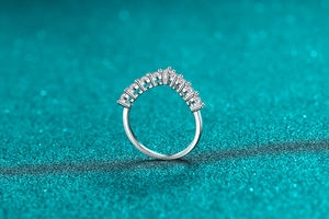 Macro shot of V-shaped S925 sterling silver band with sparkling moissanite stones