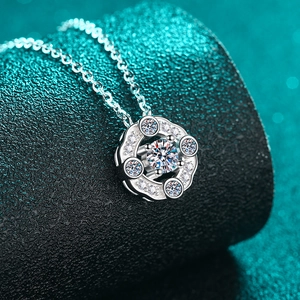 Classic S925 sterling silver four-prong moissanite necklace with a luxury turquoise background