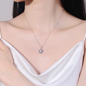 S925 sterling silver snowflake necklace featuring light blue moissanite on a fine chain
