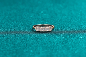 Macro detail of champagne gold S925 silver ring with four rows of brilliant moissanite stones