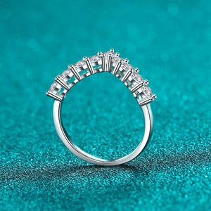 Sparkling S925 sterling silver V-shaped moissanite ring with nine stones on blue background