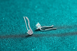 Detailed view of S925 sterling silver ear crawlers with heart moissanite and micro-pave stones