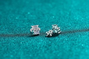 Macro view of S925 sterling silver bow earrings with brilliant moissanite center stone