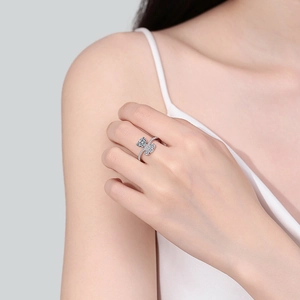 Elegant S925 sterling silver bow ring with shimmering moissanite stones on finger
