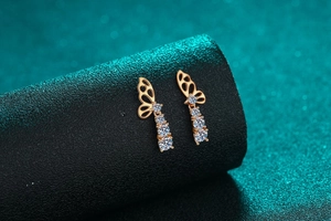 Detailed macro view of S925 silver butterfly earrings with cascading zircon stones