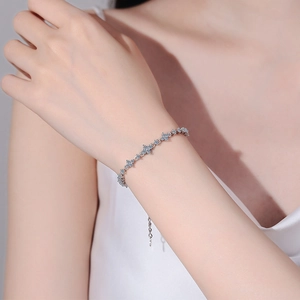 Elegant S925 sterling silver moissanite flower bracelet on woman's wrist for gift