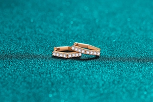 Macro shot of 925 sterling silver hexagonal hoop earrings with champagne gold plating