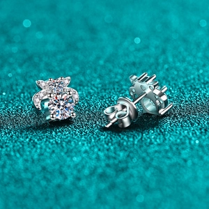 Sparkling S925 sterling silver moissanite butterfly stud earrings on textured teal background