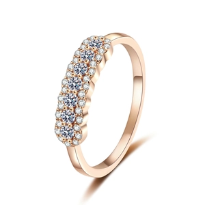 Elegant S925 champagne gold ring with seven moissanite stones in a minimalist setting