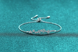 Macro detail of S925 sterling silver moissanite bracelet with star zircon and sliding clasp