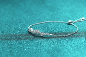 Detailed view of S925 sterling silver moissanite bracelet with sparkling floral accents