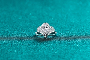 Macro shot of S925 silver pear-shaped moissanite ring with elegant crown design