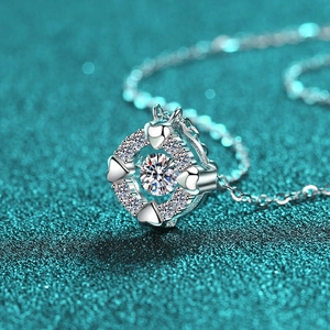 S925 Sterling Silver Heart Necklace with Dancing Moissanite on Teal Background