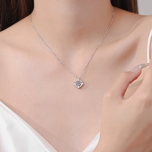 Elegant S925 sterling silver heart moissanite dancing stone necklace shown on model