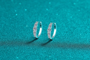 Close-up of S925 sterling silver hoop earrings with five sparkling moissanite stones