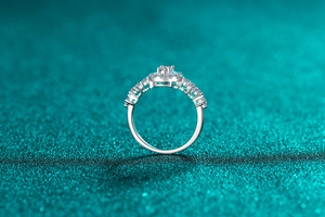 Macro detail of silver S925 ring with oval blue moissanite and pave diamond setting