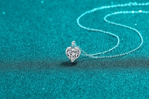 Macro shot of a minimalist S925 silver heart pendant necklace with moissanite sparkle