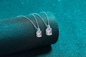 Macro shot of S925 sterling silver necklaces with emerald cut crystal pendants