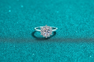 Detail of S925 sterling silver moissanite sunflower ring with sparkling petal setting