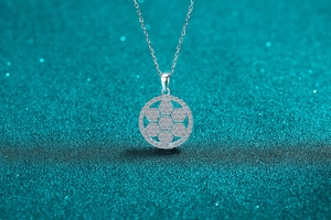 Macro shot of S925 sterling silver snowflake pendant with moissanite stones on chain