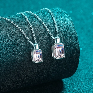 Minimalist S925 silver necklace with emerald cut pink moissanite pendant on textured stand
