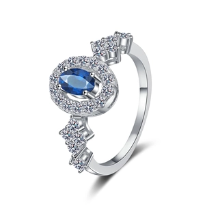 S925 sterling silver ring featuring an oval blue moissanite with halo diamonds