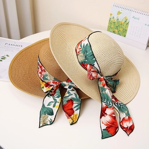 Chic wide-brim straw sun hats with floral ribbon bows for summer beach protection