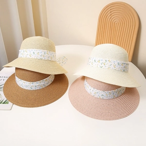 Women's summer straw hats with floral ribbons in beige, coffee, white, and pink