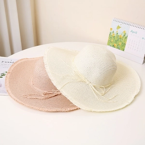 Women's wide brim straw sun hats with frayed edges and bowknot for summer beach wear
