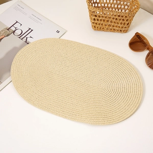 Detailed oval woven straw mat with spiral texture for DIY party hats or decor