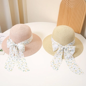 Summer straw sun hat with floral ribbon and bow for beach vacation, pink and beige