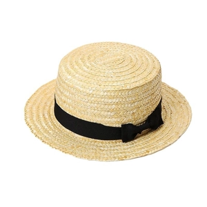 Classic straw boater hat with black ribbon and bow on a clean white background