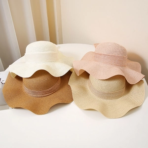 Wide brim straw sun hats for women in four colors with decorative ribbon bands