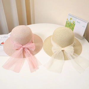 Women's summer straw hats with elegant mesh bows and pearls in pink and beige colors
