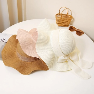 Wide brim straw sun hats with elegant bow knots for beach holidays in various colors