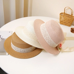 Flat top straw hat with white floral lace trim in khaki, cream, and pink colors