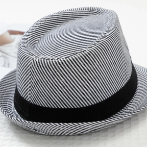 Detail view of the black and white striped jazz hat with black decorative ribbon band
