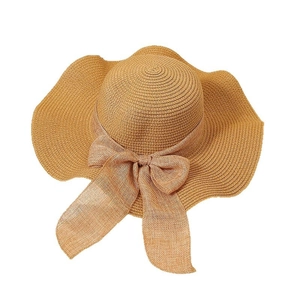 Wide brim straw sun hat for women with wavy edge and decorative bow for beach vacation