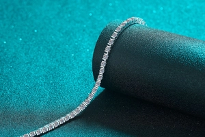Macro view of S925 sterling silver tennis bracelet with round cut moissanite stones