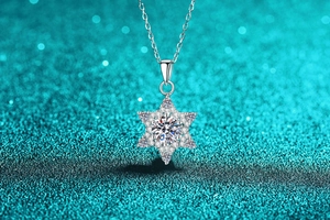 Macro detail of snowflake pendant necklace with S925 silver and moissanite center stone